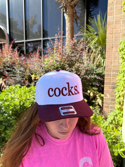 cocks. hat